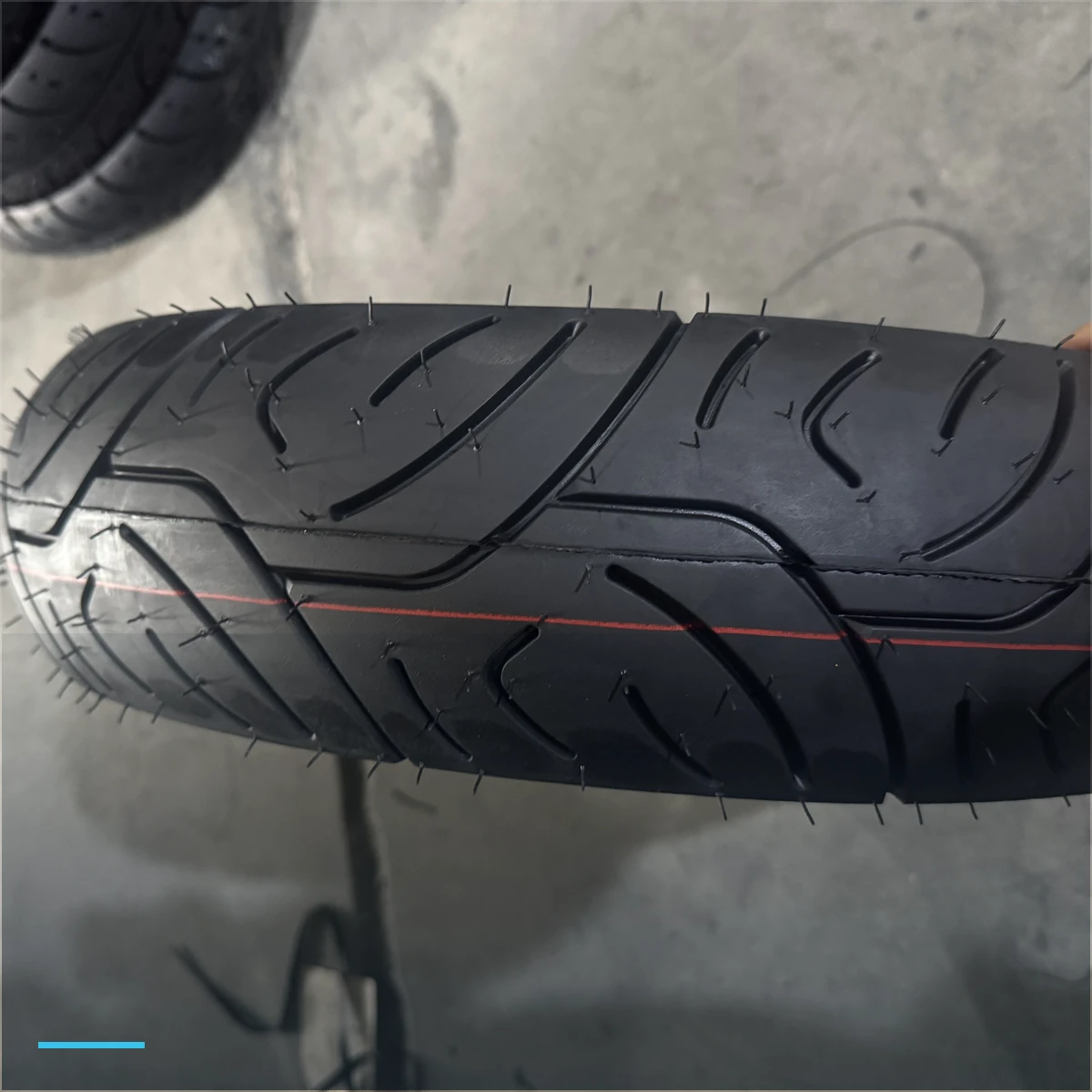Street motorcycle tire tread held during a warehouse inspection