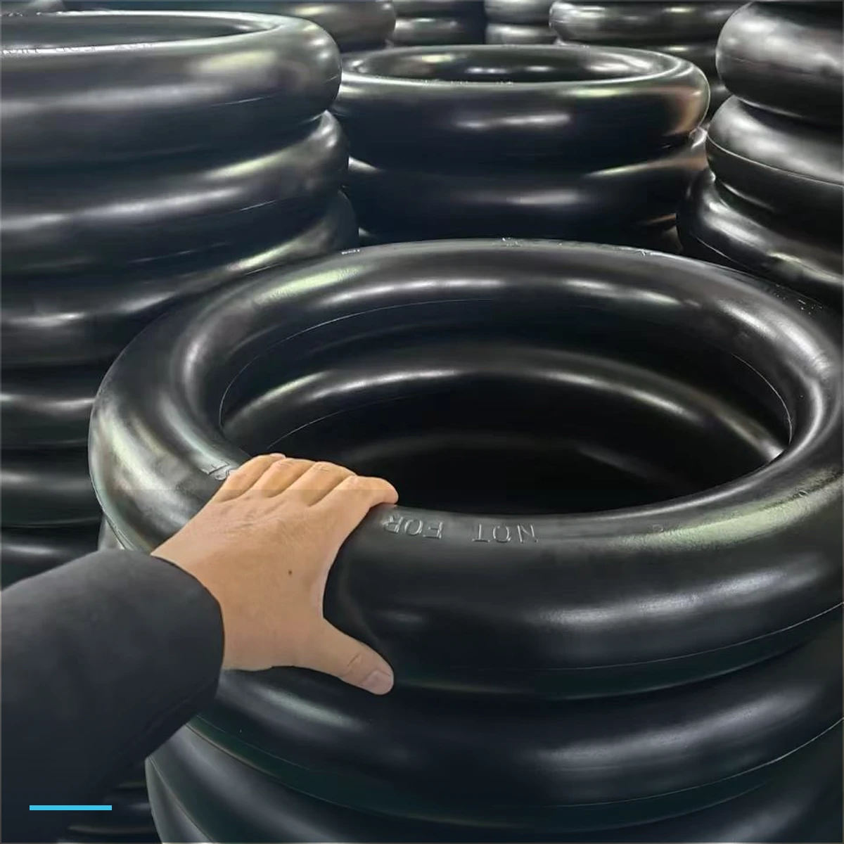 Stacked mousse inner tubes in a warehouse